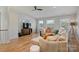 Bright living room boasts hardwood floors, neutral decor, and plenty of natural light at 106 Orange St, Charlotte, NC 28205