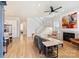Bright living room with hardwood floors, fireplace, and staircase at 106 Orange St, Charlotte, NC 28205