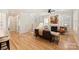 Bright living room with hardwood floors, fireplace, and staircase at 106 Orange St, Charlotte, NC 28205