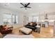 Open-concept living space with hardwood floors connecting living, dining, and kitchen areas at 106 Orange St, Charlotte, NC 28205