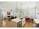 Open-concept kitchen and living space with abundant natural light and fireplace at 106 Orange St, Charlotte, NC 28205
