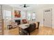 Bright living room with hardwood floors, fireplace, and staircase at 106 Orange St, Charlotte, NC 28205