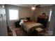 Comfortable bedroom featuring a ceiling fan, natural light, and neutral color palette at 1206 Spring Dr, Shelby, NC 28150
