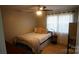 Cozy bedroom features soft natural light, comfortable bed and a ceiling fan at 1206 Spring Dr, Shelby, NC 28150