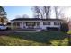 Charming single-story white brick home with a covered carport and cozy front porch at 1206 Spring Dr, Shelby, NC 28150
