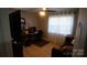 Home office space with natural light, computer desk, and comfortable seating at 1206 Spring Dr, Shelby, NC 28150