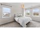 Bright bedroom with plush carpet and two windows offering ample natural light at 12202 Anne Blount Aly, Davidson, NC 28036