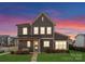 Charming two-story home with a well-manicured lawn and inviting entryway, perfect for a Gathering at 12202 Anne Blount Aly, Davidson, NC 28036