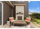 Outdoor fireplace with stone surround and seating area, ideal for entertaining at 12202 Anne Blount Aly, Davidson, NC 28036