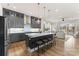 Open-concept kitchen with modern gray cabinets, a large island with seating, and stainless steel appliances at 12202 Anne Blount Aly, Davidson, NC 28036