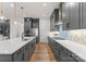 Bright, modern kitchen with gray cabinets, stainless steel appliances, and a large island, perfect for entertaining at 12202 Anne Blount Aly, Davidson, NC 28036