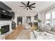 Modern living room with an open concept design, fireplace, and sleek decor at 12202 Anne Blount Aly, Davidson, NC 28036