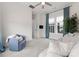 Bright living room with plush sofa, accent chair, and large window with natural light at 12202 Anne Blount Aly, Davidson, NC 28036