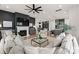 Open concept living area showcasing kitchen, dining, and living room with modern furnishings at 12202 Anne Blount Aly, Davidson, NC 28036