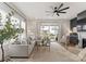 Open living room with a sectional sofa, modern decor, and access to the backyard at 12202 Anne Blount Aly, Davidson, NC 28036