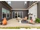Outdoor patio with stone fireplace and cozy seating, great for relaxing or entertaining at 12202 Anne Blount Aly, Davidson, NC 28036