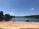 Enjoy the lake at the sandy community beach on a sunny day at 134 Cardinal Ave, New London, NC 28127