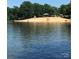 Scenic view of the public beach at Badin Lake on a clear day at 134 Cardinal Ave, New London, NC 28127