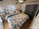 Cozy bedroom features a comfortable bed, ample natural light, and stylish decor at 134 Cardinal Ave, New London, NC 28127