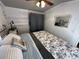 Serene bedroom with soft lighting, comfortable bed, and stylish decor at 134 Cardinal Ave, New London, NC 28127