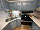 Charming kitchen with stainless steel appliances and plenty of cabinet space at 134 Cardinal Ave, New London, NC 28127