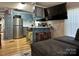 Cozy kitchen with painted blue cabinets, stainless steel appliances, and a breakfast bar at 134 Cardinal Ave, New London, NC 28127