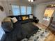 Comfortable living room featuring a sectional sofa, patterned rug, and natural light at 134 Cardinal Ave, New London, NC 28127