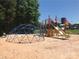 Community playground with climbing dome, slide, and play structure at 134 Cardinal Ave, New London, NC 28127