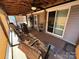 Spacious screened porch featuring a ceiling fan, comfortable seating, and natural light at 134 Cardinal Ave, New London, NC 28127