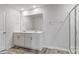 Bathroom featuring double sinks, a large mirror, and a glass-enclosed shower at 1346 37Th Avenue Ne Ln, Hickory, NC 28601