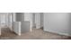 Bright, carpeted second floor hallway showing a view of a landing and several doors at 1346 37Th Avenue Ne Ln, Hickory, NC 28601