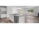 Bright kitchen featuring granite countertops, stainless steel appliances and luxury vinyl plank flooring at 1346 37Th Avenue Ne Ln, Hickory, NC 28601