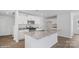 Bright kitchen featuring granite countertops, stainless steel appliances, and a central island at 1346 37Th Avenue Ne Ln, Hickory, NC 28601