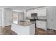 Bright kitchen featuring granite countertops, stainless steel appliances, and a central island at 1346 37Th Avenue Ne Ln, Hickory, NC 28601