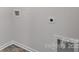Close-up of a neutral-colored laundry room wall showing an open hookup and nearby doorframe at 1346 37Th Avenue Ne Ln, Hickory, NC 28601