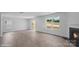 Bright living room featuring a fireplace, a sliding glass door, and luxury vinyl plank flooring at 1346 37Th Avenue Ne Ln, Hickory, NC 28601