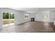 Bright living room featuring a fireplace, a sliding glass door, and luxury vinyl plank flooring at 1346 37Th Avenue Ne Ln, Hickory, NC 28601
