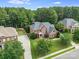 High angle of property with mature landscaping, a long driveway, and tree-lined streets at 14314 Lissadell Cir, Charlotte, NC 28277