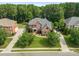 Aerial view of home with mature trees surrounding the property and a long driveway at 14314 Lissadell Cir, Charlotte, NC 28277