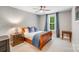 Bedroom featuring a window with curtains, a ceiling fan, and neutral walls at 14314 Lissadell Cir, Charlotte, NC 28277