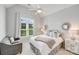 Bright bedroom featuring a window with curtains and neutral walls at 14314 Lissadell Cir, Charlotte, NC 28277