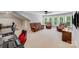 Upstairs bonus room with a comfortable sitting area and desk at 14314 Lissadell Cir, Charlotte, NC 28277
