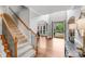 Grand foyer with a staircase, hardwood floors, and an arched entryway at 14314 Lissadell Cir, Charlotte, NC 28277