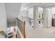 Spacious upstairs hallway with wood and iron railing at 14314 Lissadell Cir, Charlotte, NC 28277
