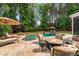 Inviting backyard pool area with a spa, fire pit, lounge chairs, and lush landscaping at 14314 Lissadell Cir, Charlotte, NC 28277