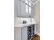 Stylish wet bar with a wine refrigerator, glass-front cabinets, and sleek countertops at 14314 Lissadell Cir, Charlotte, NC 28277