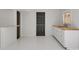 Clean basement area with white cabinets, butcher block counters, and a stylish bar setup at 14723 Sapphire Ln, Pineville, NC 28134