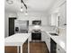 Bright kitchen with stainless appliances, stylish lighting, and quartz countertops at 14723 Sapphire Ln, Pineville, NC 28134