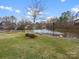 Beautiful pond with a fountain and lush green surroundings creating a serene and peaceful atmosphere at 14723 Sapphire Ln, Pineville, NC 28134