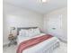 Bright bedroom featuring a bed with neutral pillows and a pink throw at 15140 Rocky Bluff Loop, Davidson, NC 28036